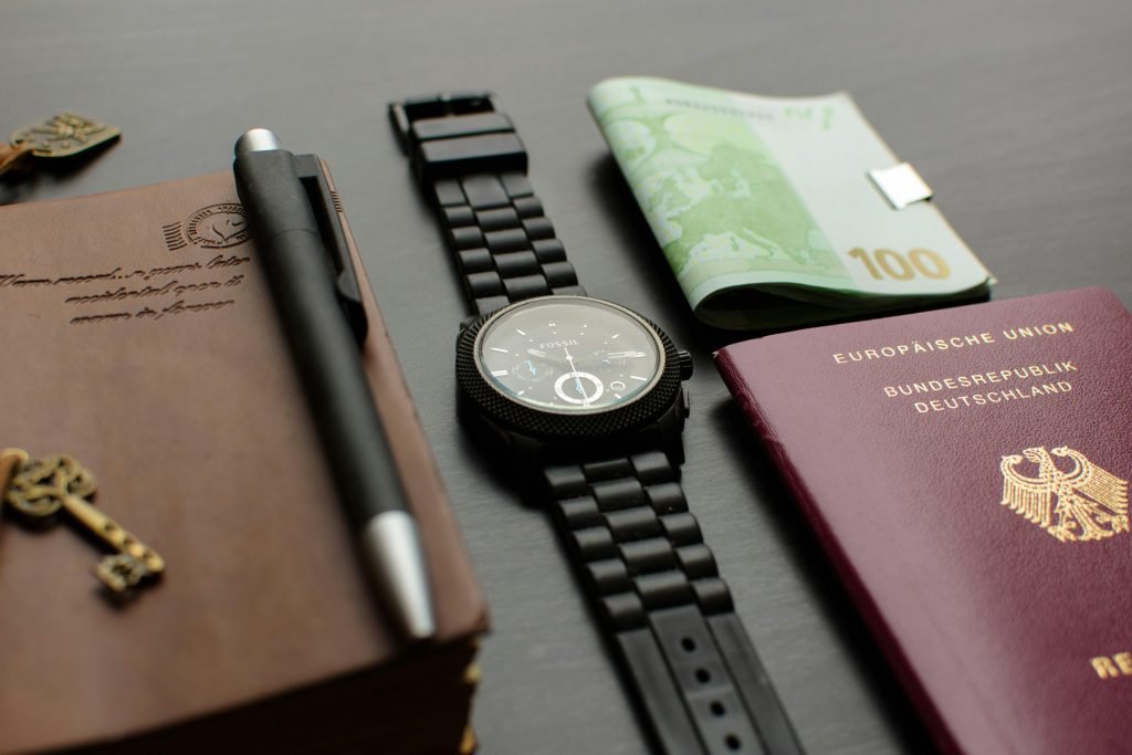 Solo travel - picture with passport pen and watch